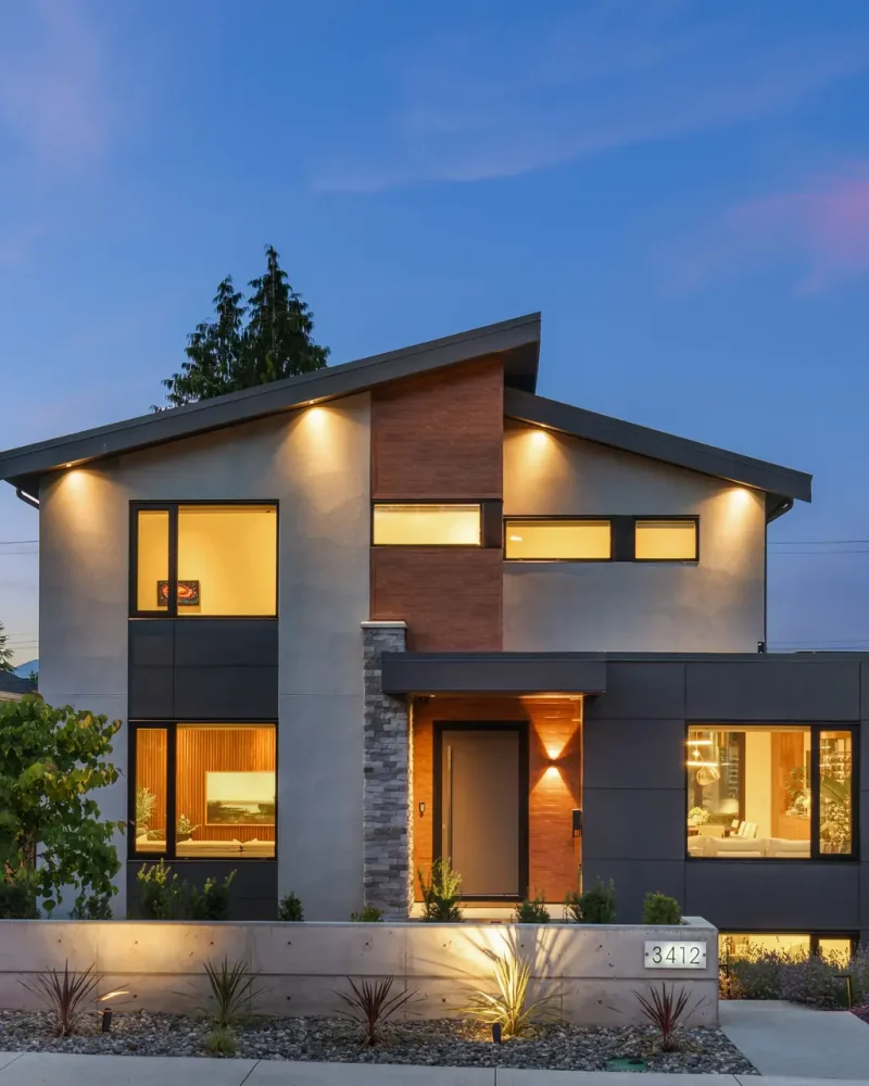 Modern custom home exterior at dusk in Vancouver by VictorEric